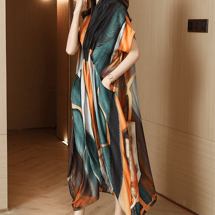 שמלת מעצב בגיזרה אסימטרית של מעצב בגימור כיסים משגע ובצבעוניות מרהיבה - לה איסלה 